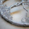 side view illustrates details of glass beaded roots and twisted tree trunk